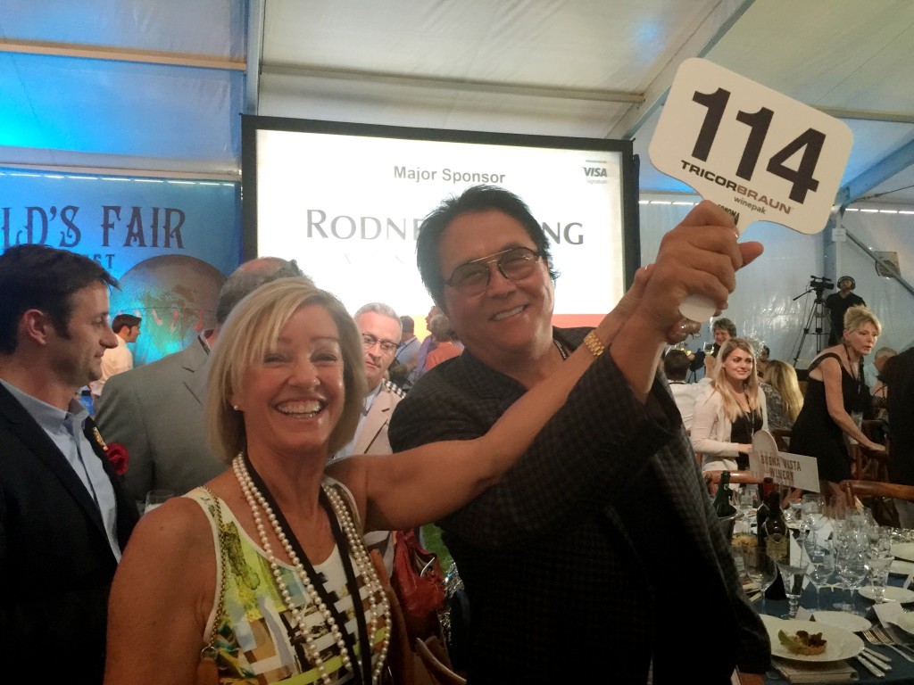 Robert and Kim Kiyosaki bid on several lots, raising hundreds of thousands of dollars for charity.